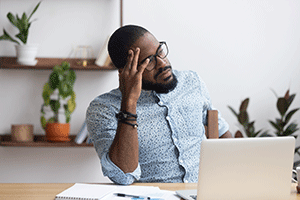 man at desk with computer