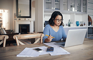 woman reviewing bank statements online